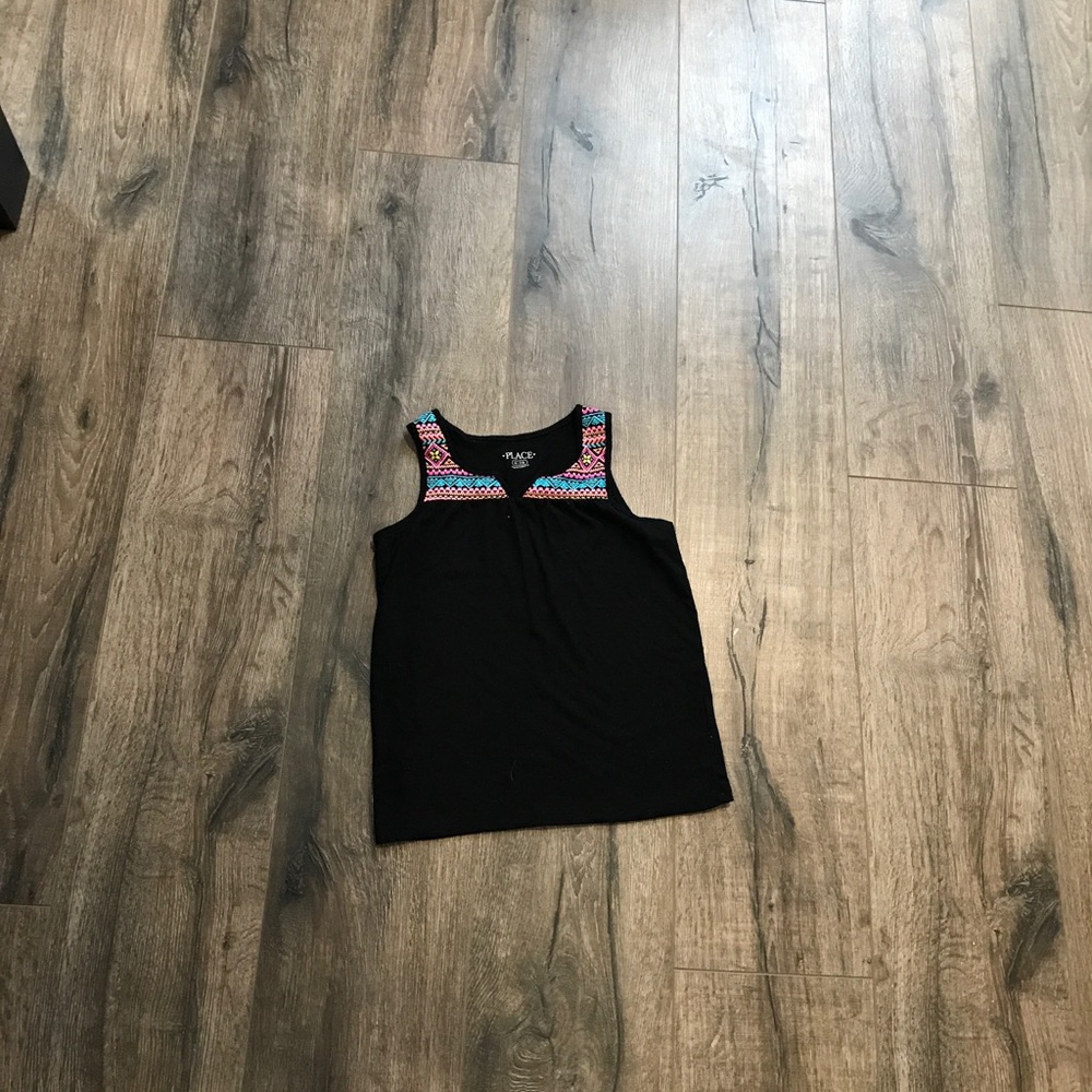 Black tank with details around collar